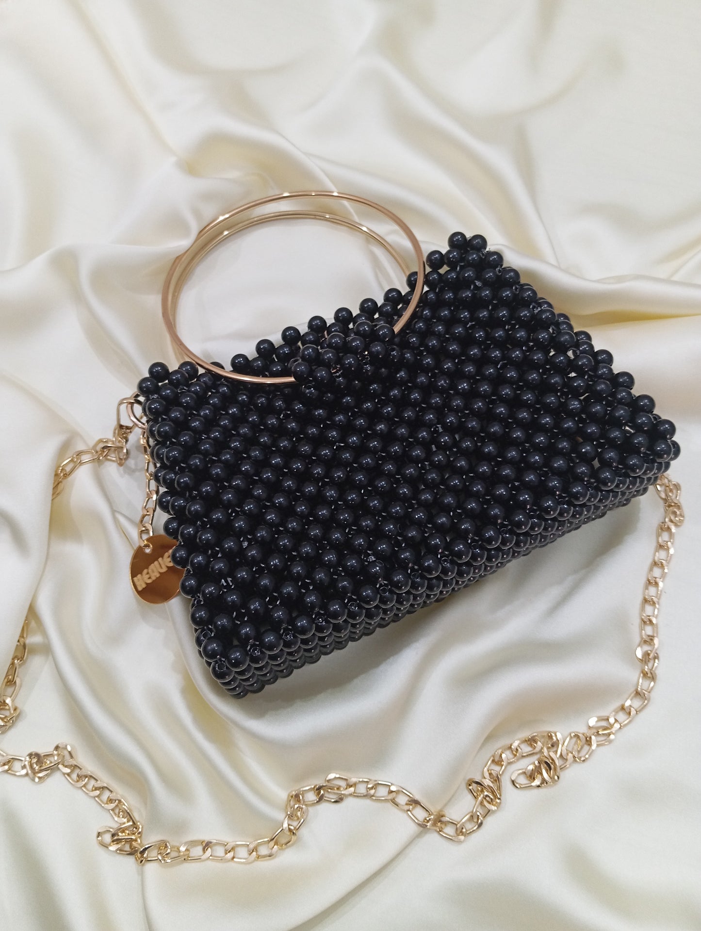 Pack beaded bag with golden handle